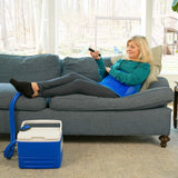 Woman lying on a blue couch using an Active Ice® Extended Hip Cold Therapy 9-quart System on her left hip