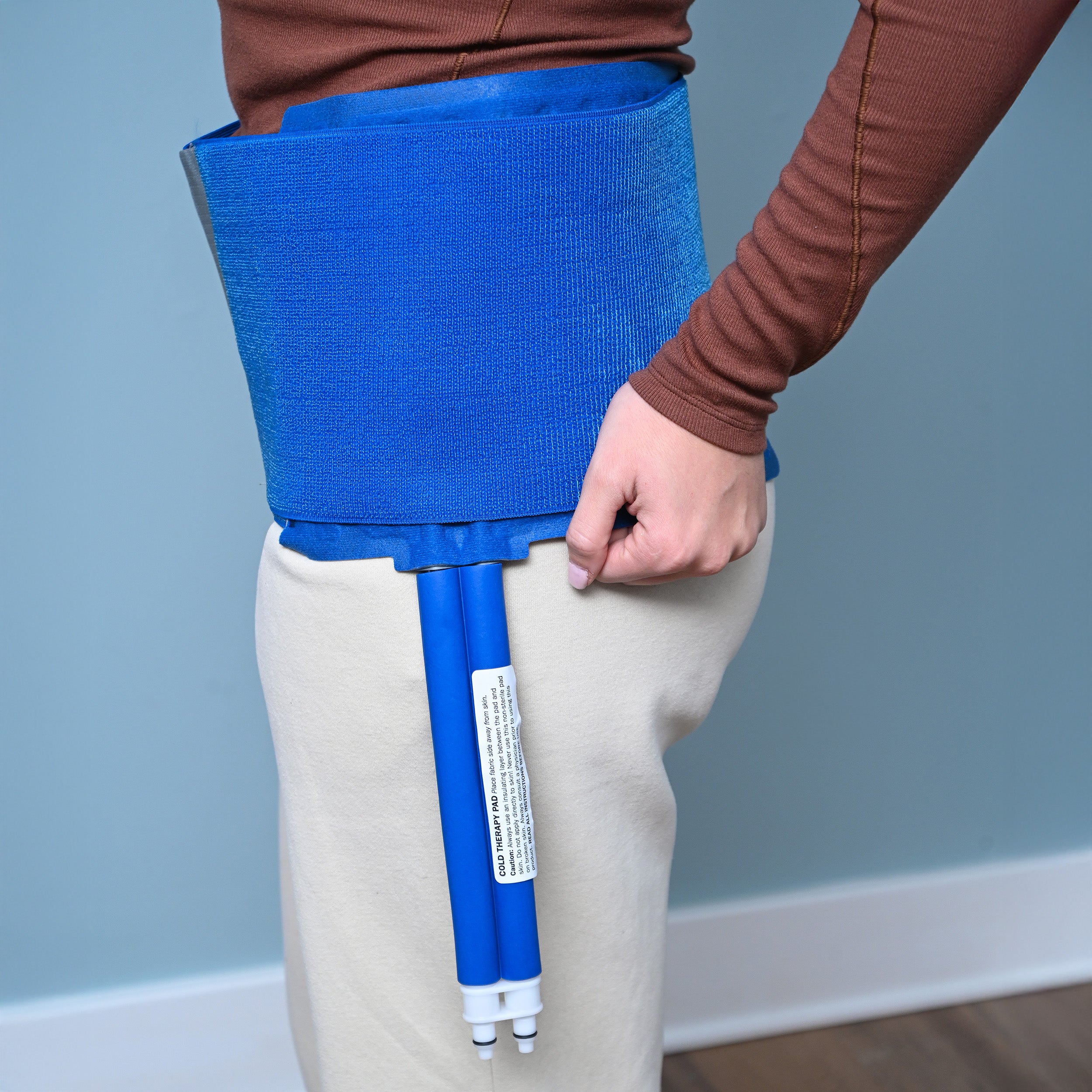 Person wearing blue Active Ice® 3.0 Back & Hip Cold Therapy Pad on hip