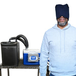 Woman with a circulating water cooling extended head cap next to a cool flow® circulating cold water machine paired with arctic chiller for continuous cooling.
