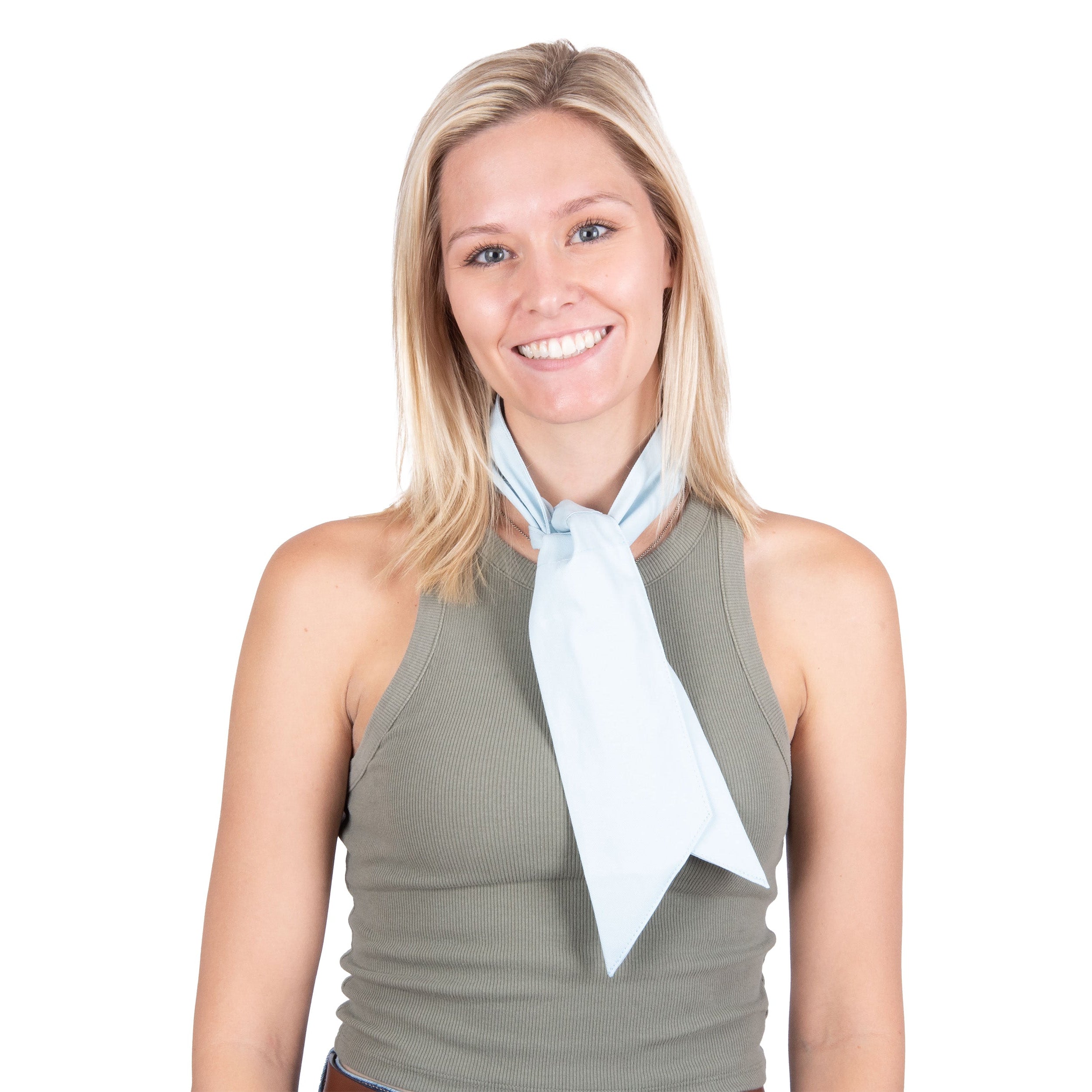 A smiling blonde woman wearing a light blue deluxe cooling neck wrap tied loosely around her neck, paired with a gray ribbed tank top, shot against a solid white background.