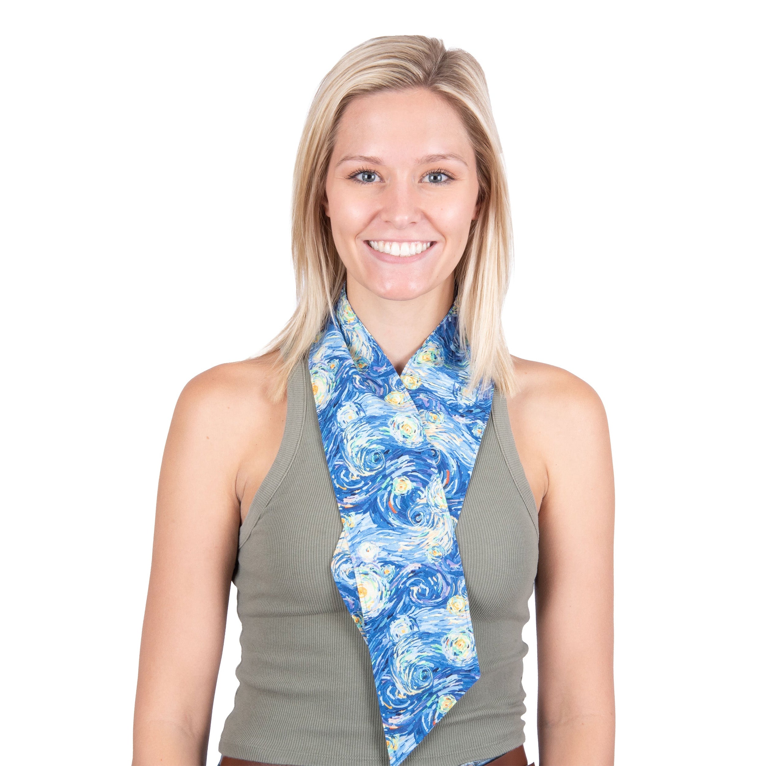 A smiling blonde woman wearing a Starry night inspired patterned cooling fashion neck scarf over a gray sleeveless top, photographed against a plain white background.