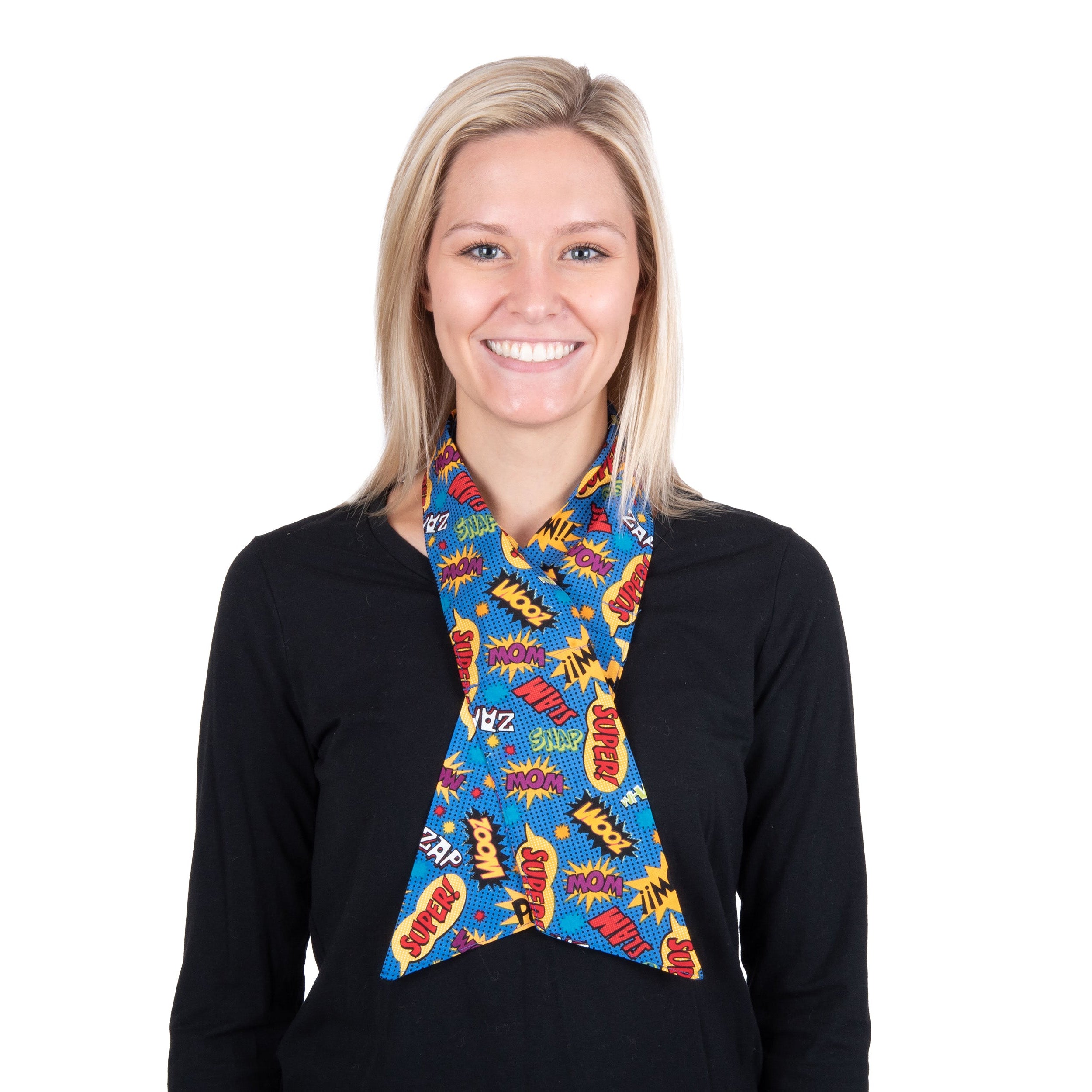 A smiling blonde woman wearing a black long-sleeve top and a colorful cooling fashion neck scarf with comic book-style illustrations, set against a plain white background.