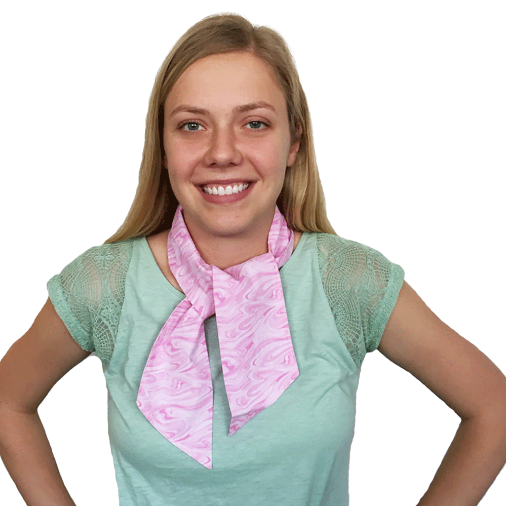 Woman wearing pink patterned Fashion Cooling Scarf on a white background.