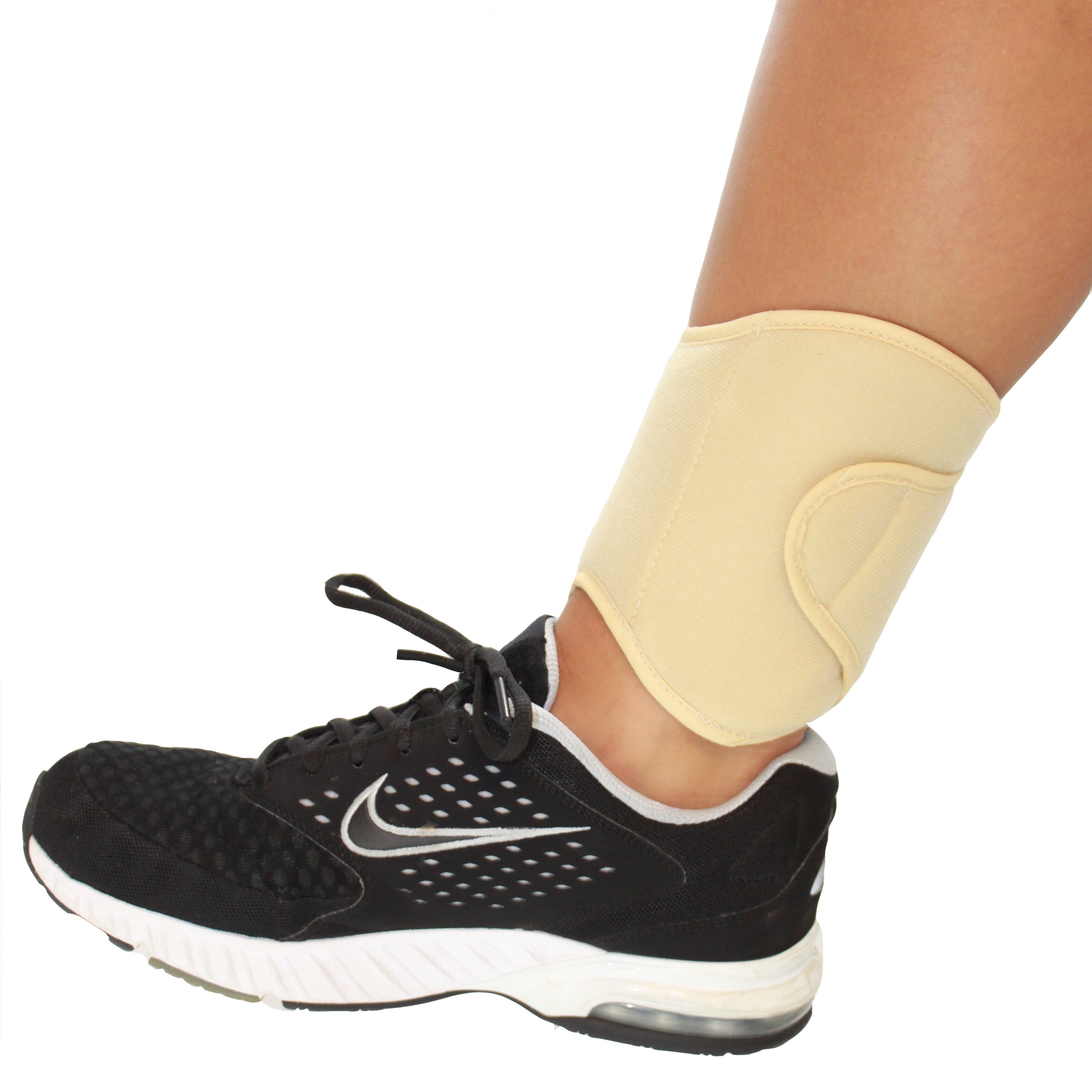 Black athletic shoe with a beige cooling ankle wrap on a white background