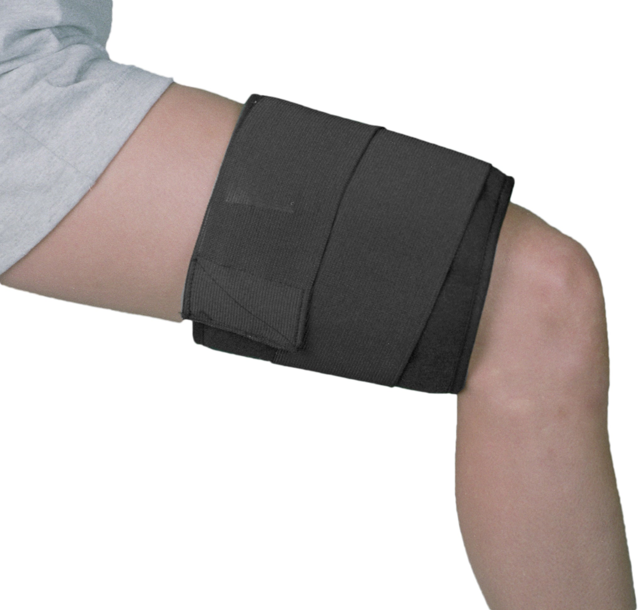 Black cooling wrap on someone's thigh with a white background