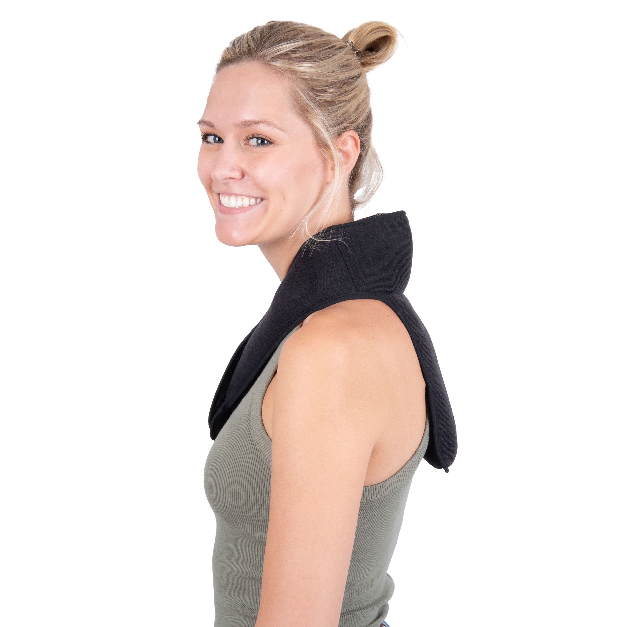 A woman with blonde hair in a bun wearing a black cooling neck and upper spine wrap over an olive green tank top, shown from the side against a solid white background.