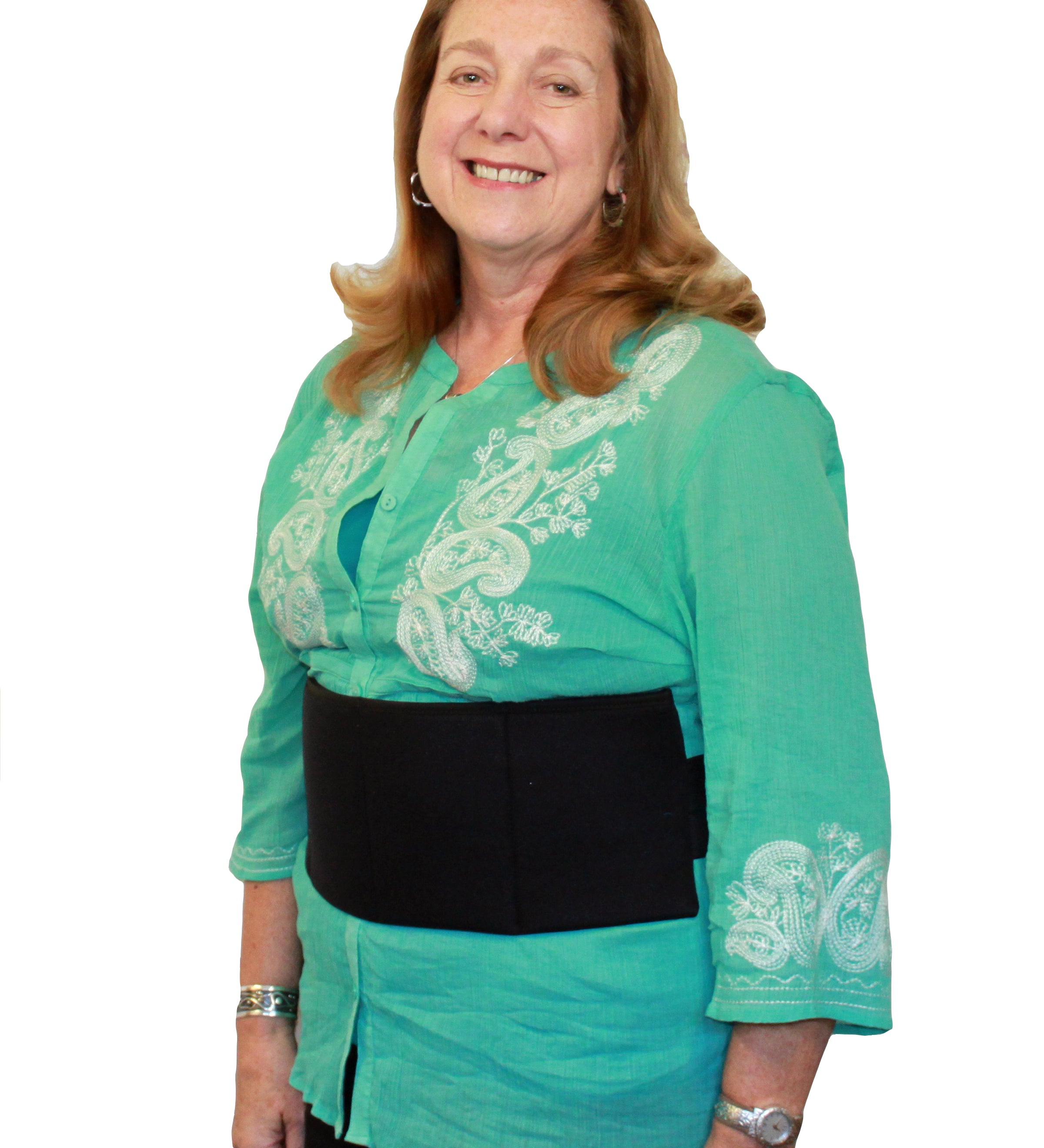 Woman wearing a green blouse with white embroidery and a black cooling torso wrap on a white background