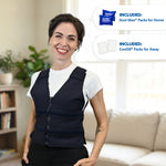 A smiling woman stands indoors wearing a dark navy adjustable cooling vest in nylon over a white T-shirt and black pants. Two callout bubbles on the right show included products: Kool Max Packs for Home and Cool58 Packs for Away.