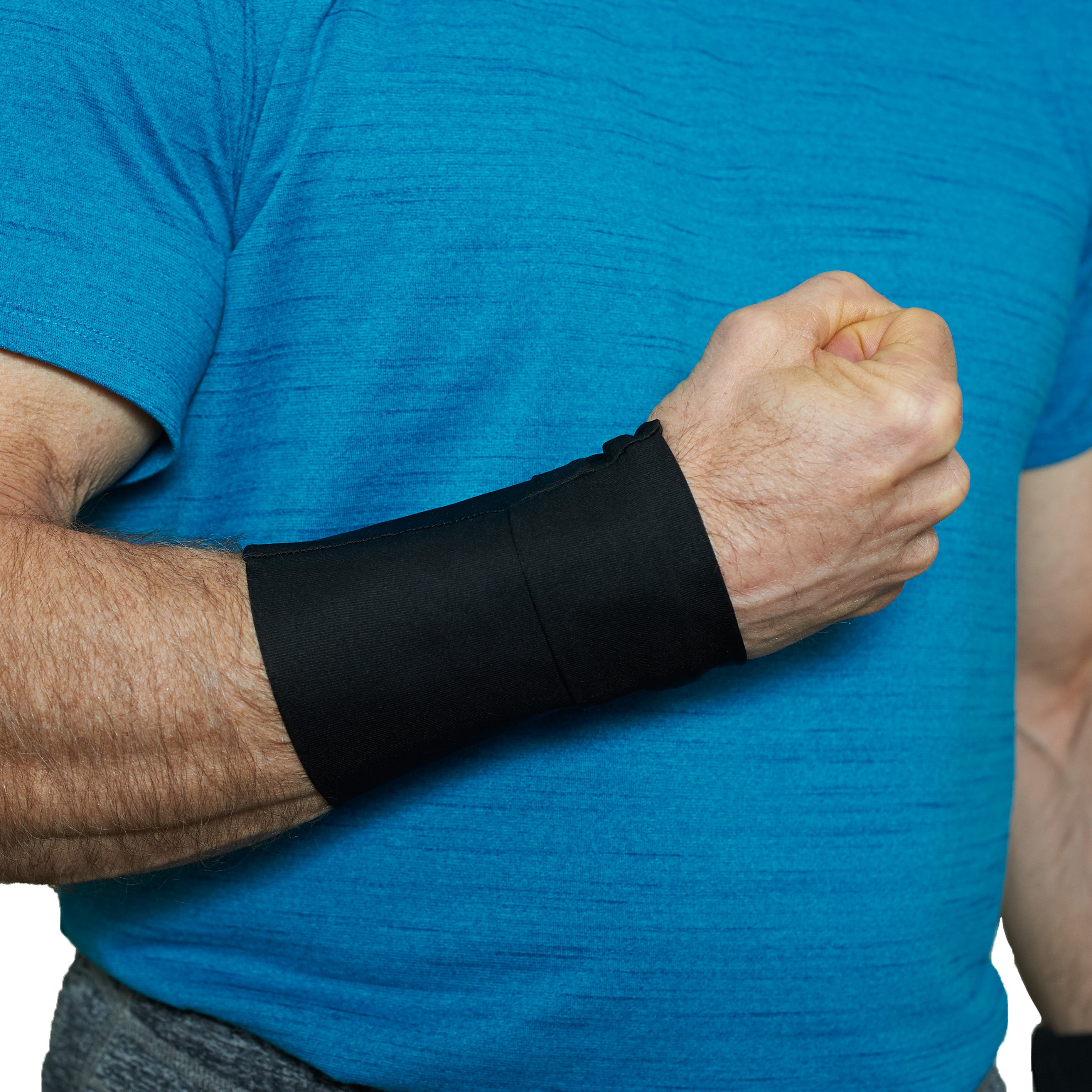 Person wearing a black cooling wrist wrap on a blue shirt background
