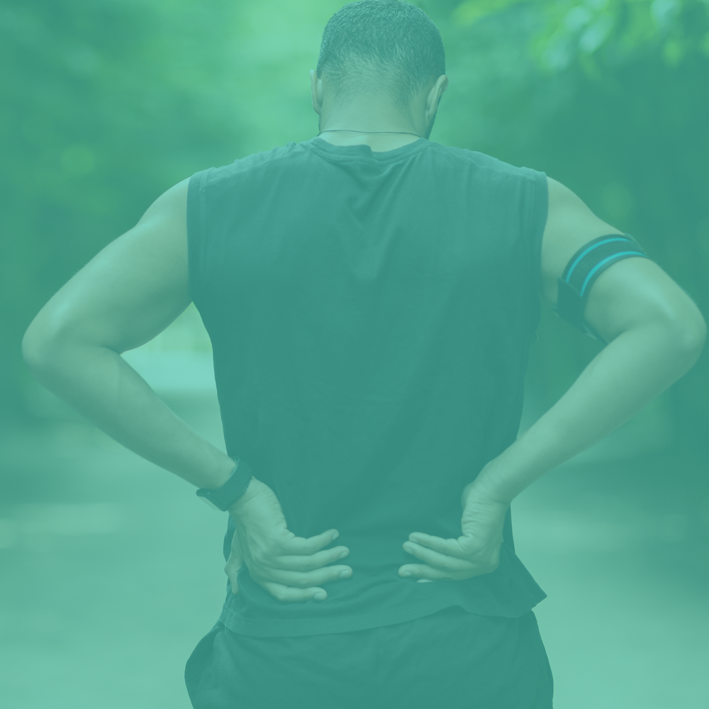 Person standing with hands on hips in a forest setting with a teal overlay.