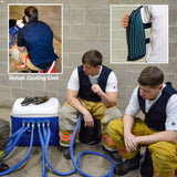 Two individuals in fire service gear using a Rehab Cooling Unit against a brick wall.