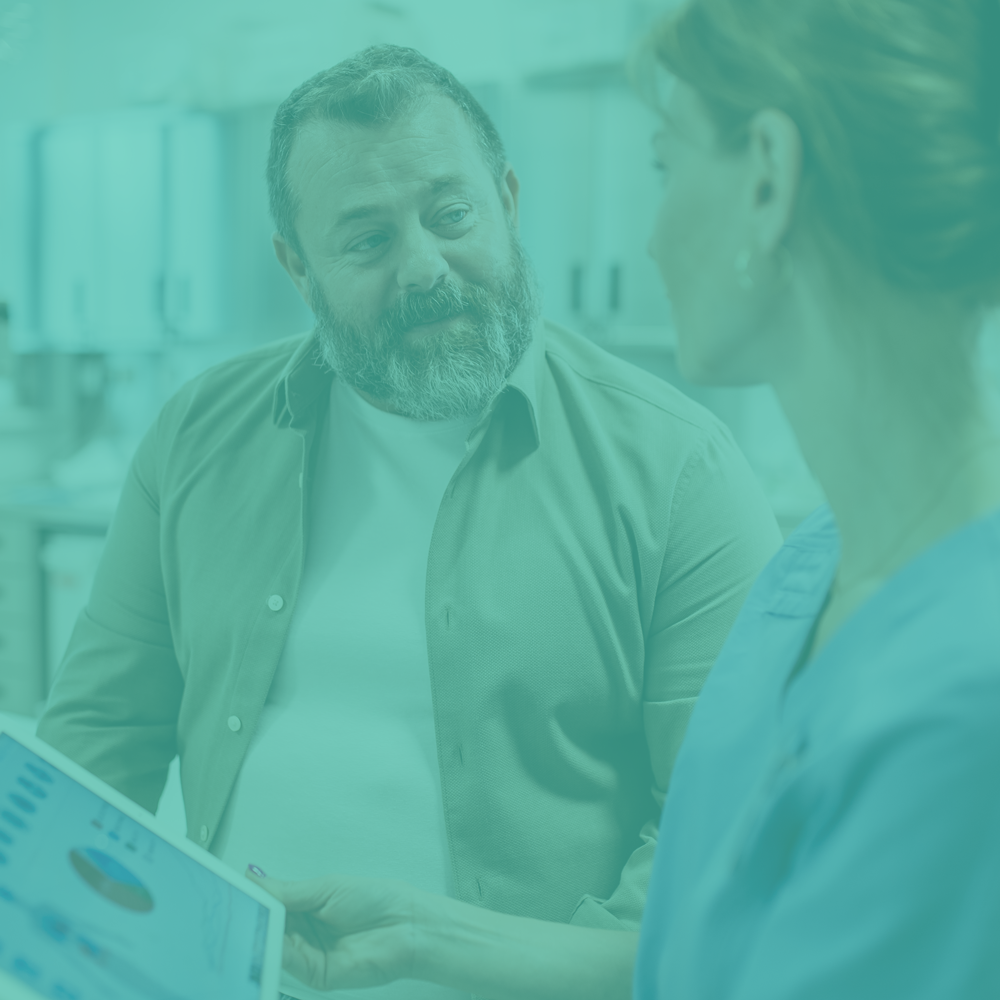 Two people discussing a document with a teal overlay